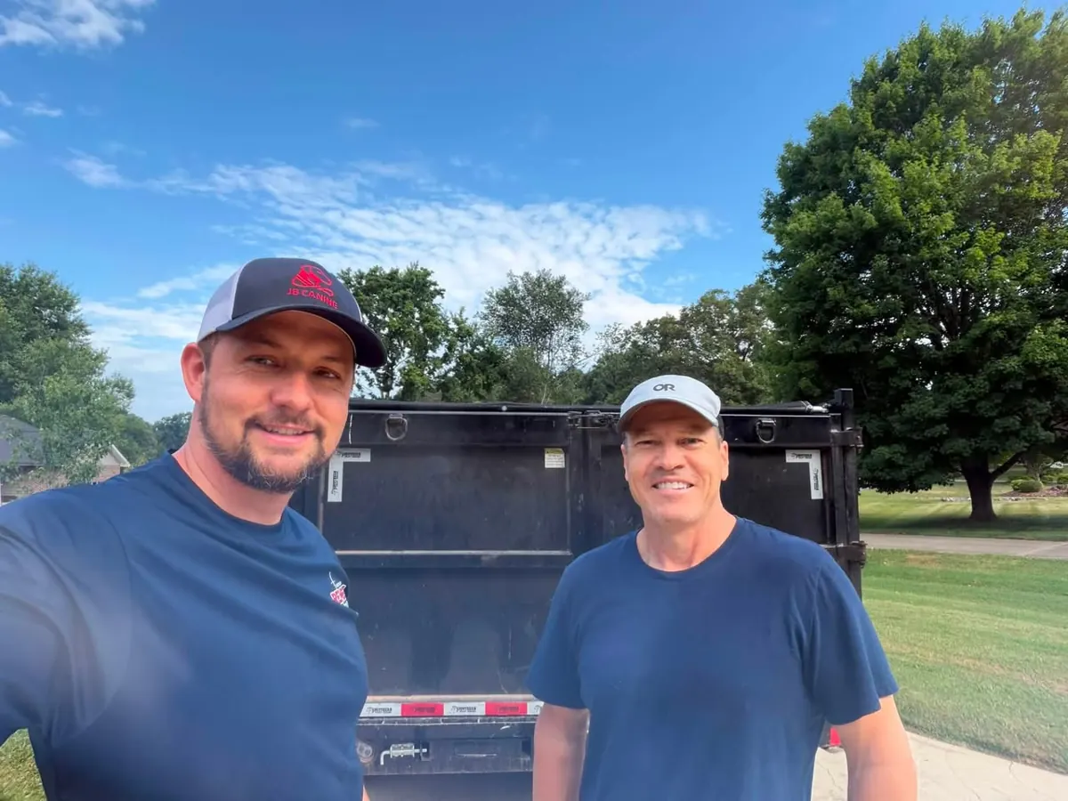 Rembert Demolition & Junk Removal with a customer