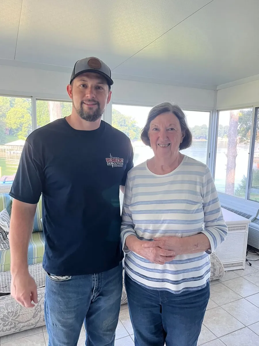 Rembert Demolition & Junk Removal with a customer after completed work